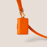 Bold orange tangerine stylish dog accessories easy clean vegan leather poop bag holder for morkie & toy poodle by Tails & Bloom