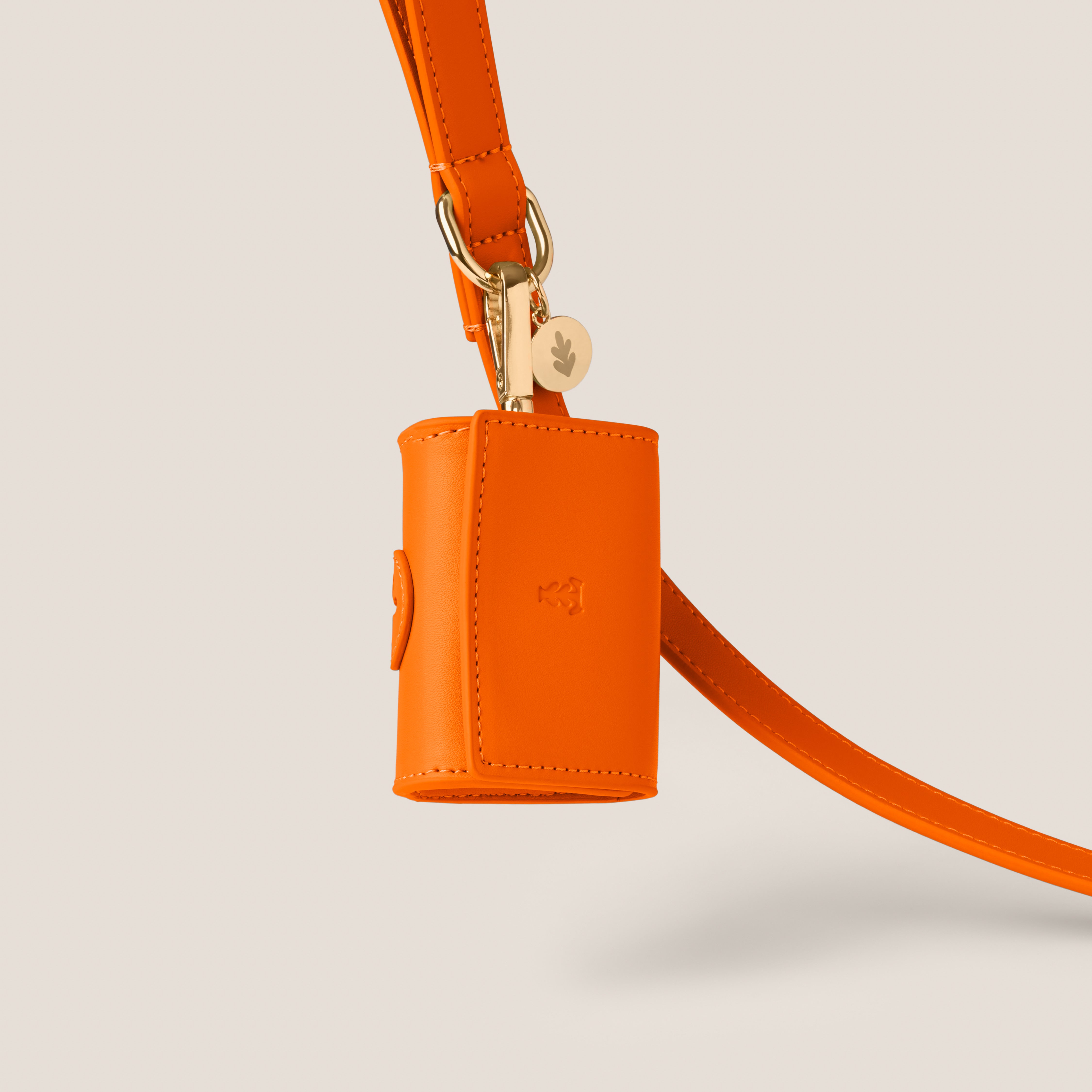 Bold orange tangerine stylish dog accessories easy clean vegan leather poop bag holder for morkie & toy poodle by Tails & Bloom