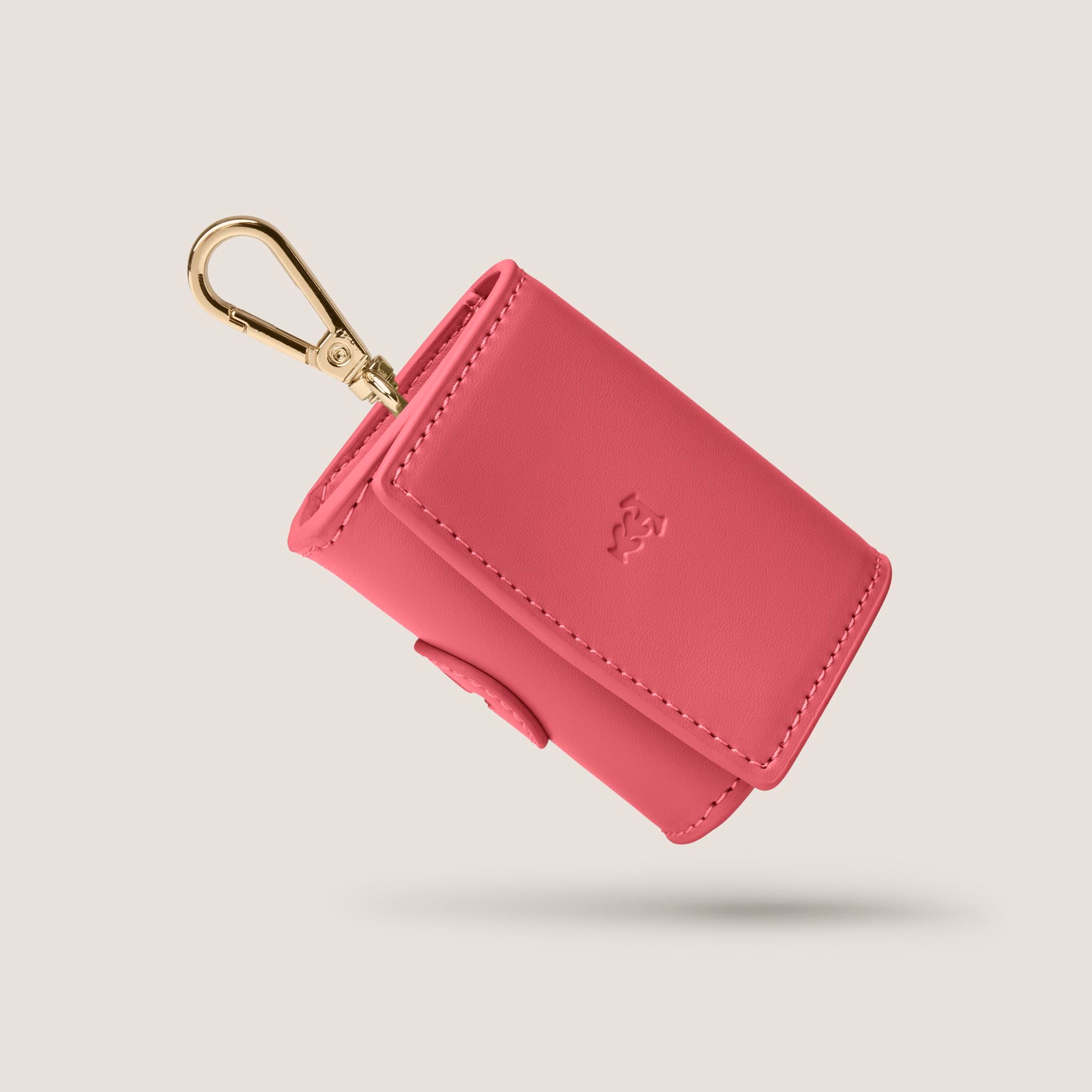 A pink vegan leather Tails & Bloom Rose Poop Bag Holder