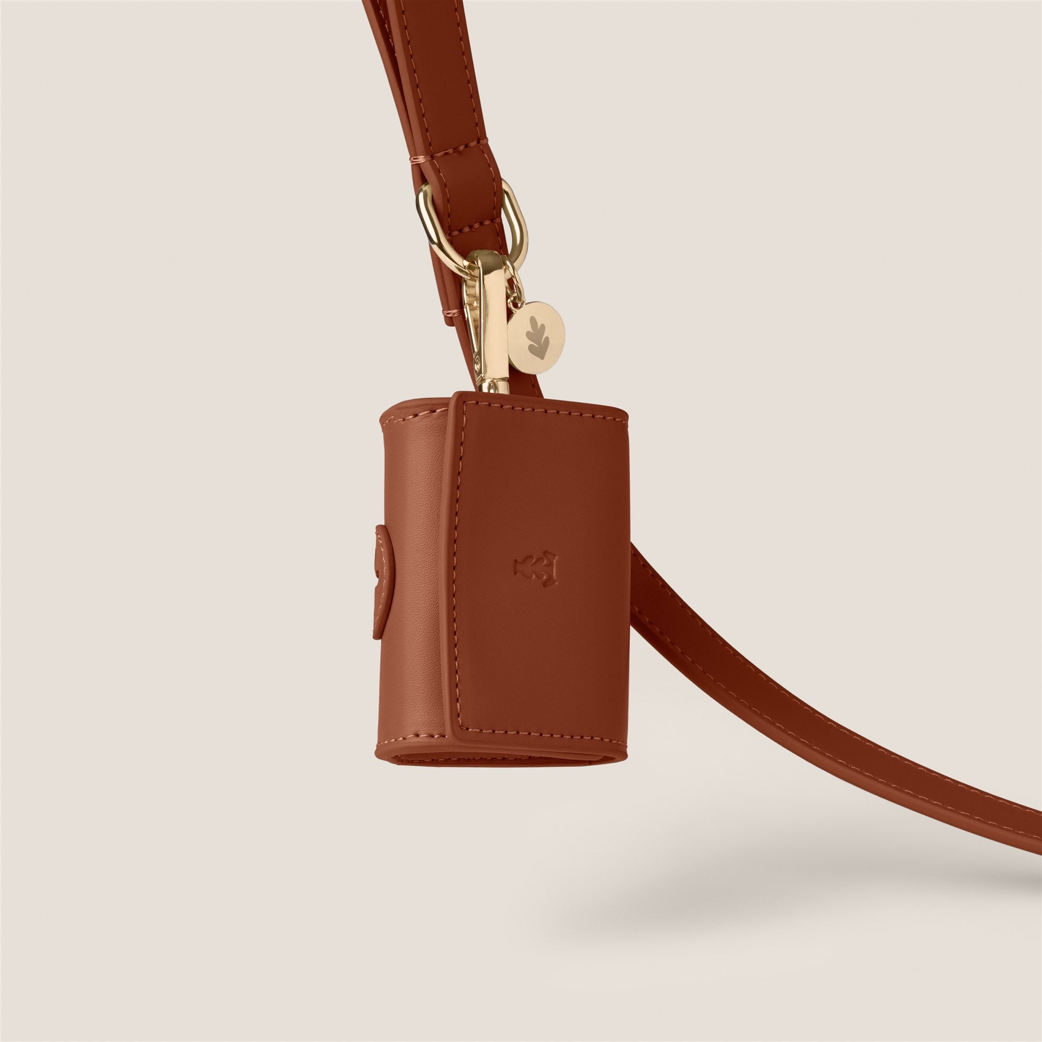 Brown tan durable easy clean vegan leather poop bag holder by Tails & Bloom