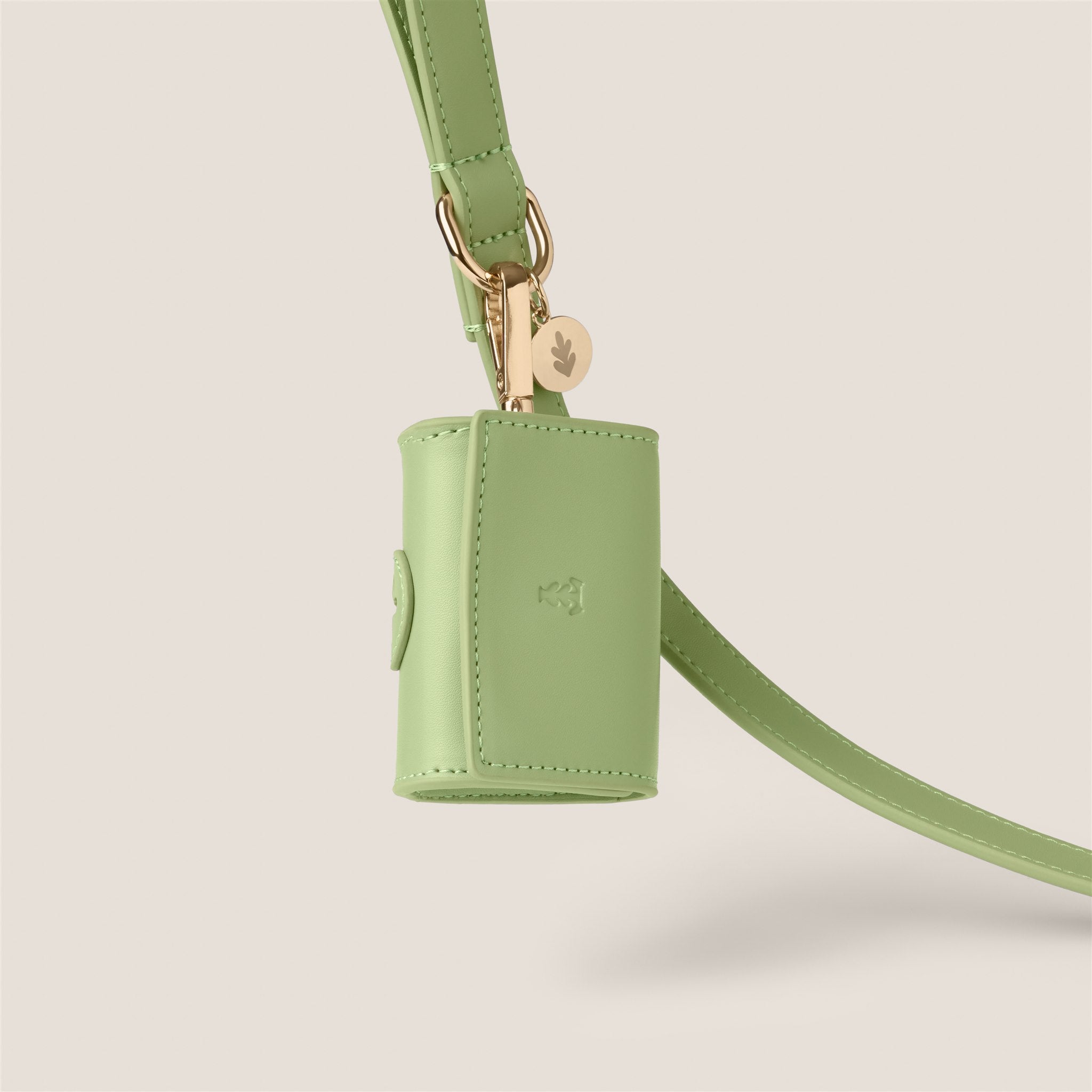 Pastel green durable easy clean vegan leather poop bag holder for cockapoo & miniature poodle by Tails & Bloom