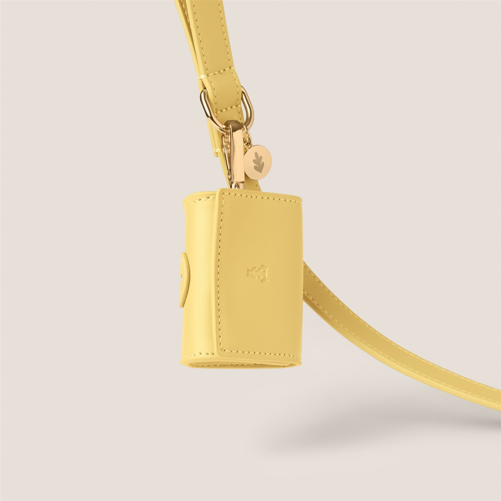 Pastel yellow primrose durable easy clean vegan leather poop bag holder for cockapoo & shih tzu by Tails & Bloom