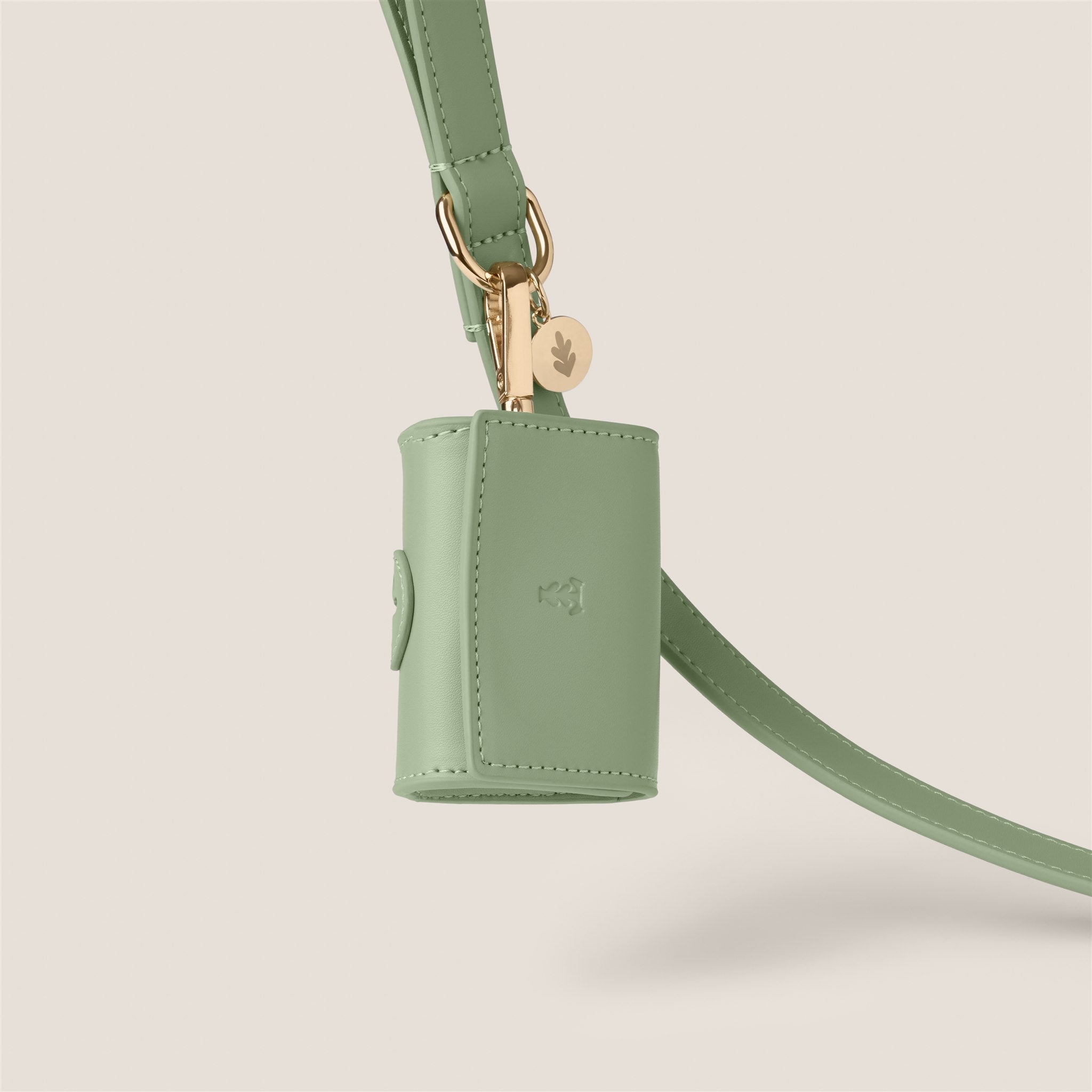 Pastel green sage stylish dog accessories easy clean vegan leather poop bag holder for morkie & toy poodle by Tails & Bloom